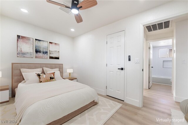 bedroom with light hardwood / wood-style floors and ceiling fan