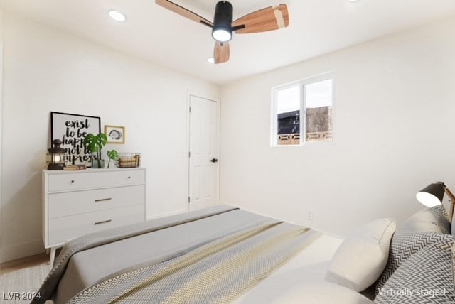 bedroom featuring ceiling fan and wood-type flooring