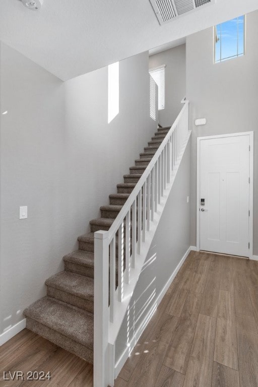 staircase featuring hardwood / wood-style floors