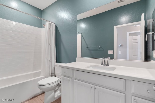 full bathroom featuring shower / tub combo, vanity, toilet, and tile patterned floors