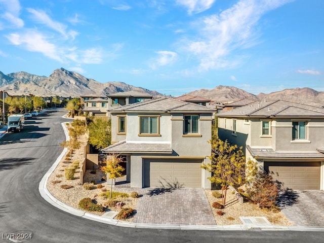 view of front of house featuring a mountain view and a garage