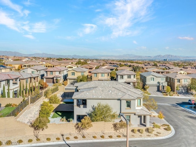 birds eye view of property with a mountain view