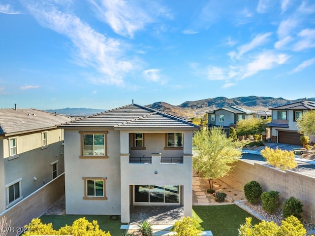 rear view of property featuring a mountain view