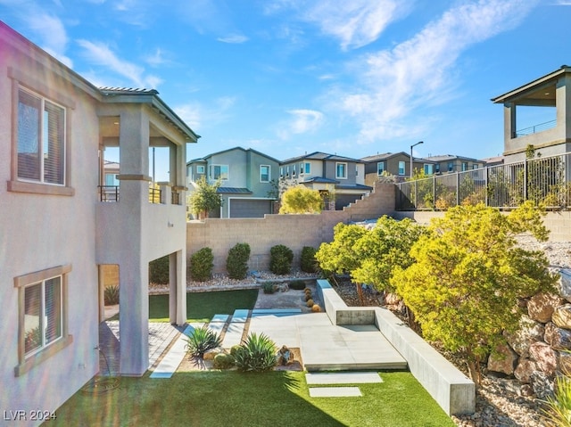 view of swimming pool featuring a patio area and a yard