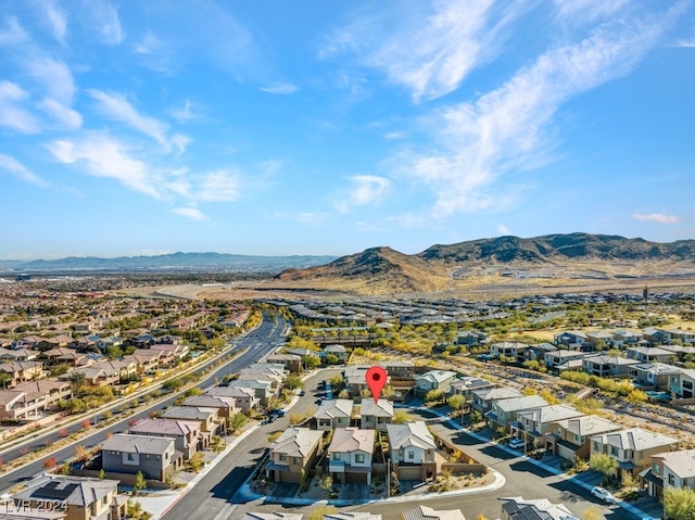 birds eye view of property featuring a mountain view