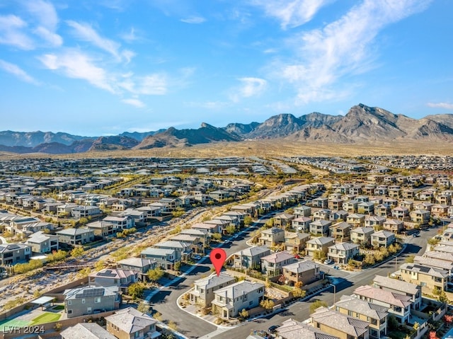 birds eye view of property featuring a mountain view