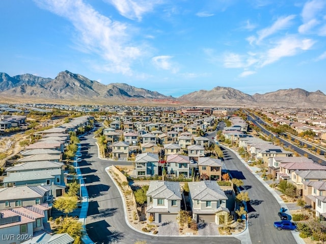 birds eye view of property with a mountain view