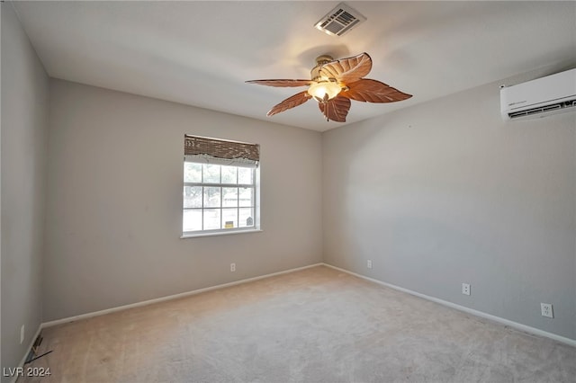 carpeted spare room featuring an AC wall unit