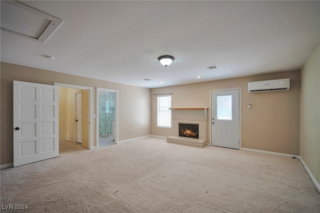 unfurnished living room featuring light colored carpet and a wall mounted air conditioner