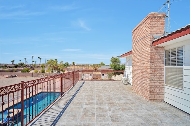 view of patio featuring a fenced in pool