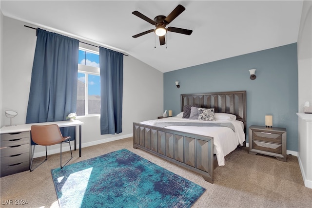 bedroom with light colored carpet, vaulted ceiling, and ceiling fan