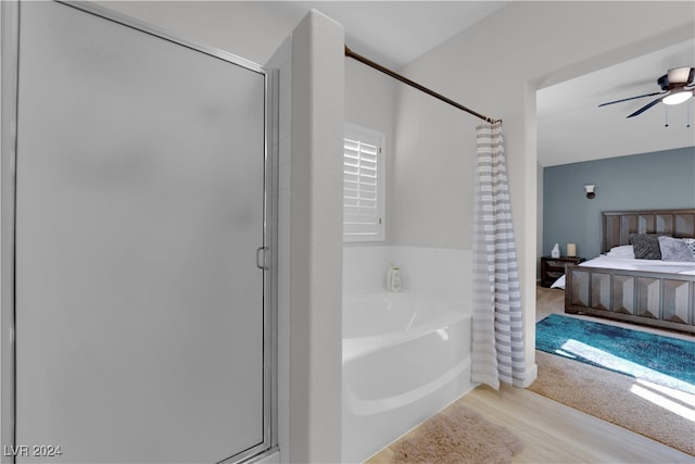 bathroom with separate shower and tub, ceiling fan, and wood-type flooring