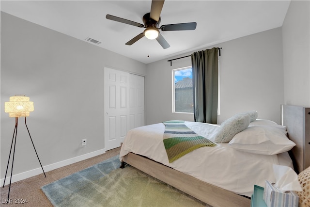 bedroom featuring carpet floors, a closet, and ceiling fan