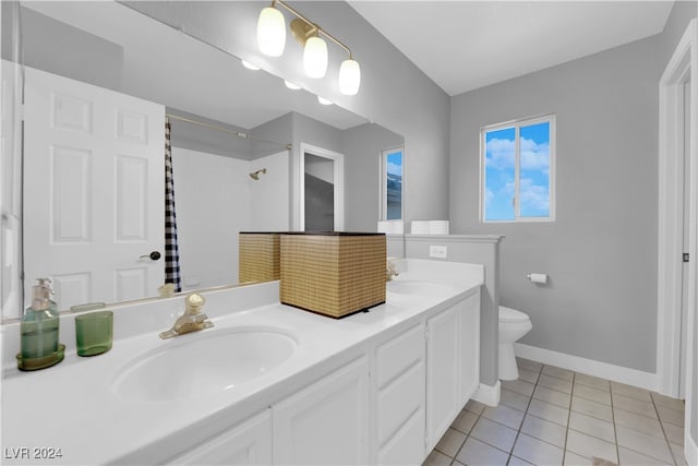 bathroom with toilet, vanity, tile patterned floors, and a shower with shower curtain