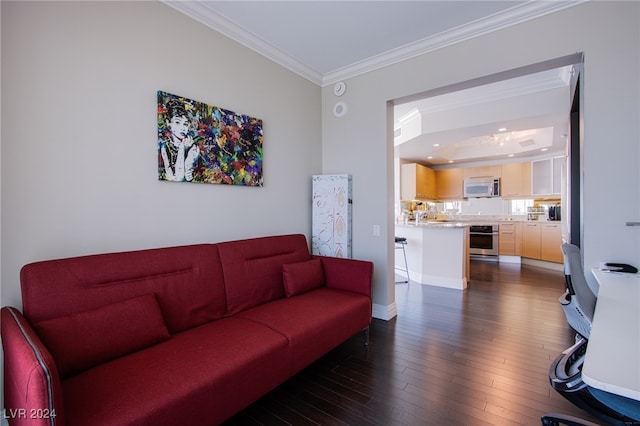 living room with dark wood-type flooring and ornamental molding