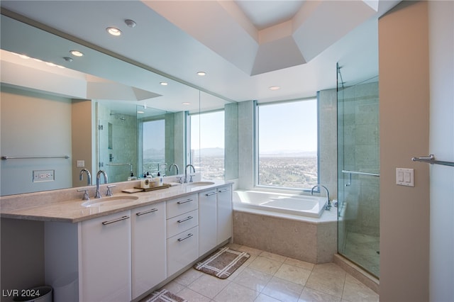 bathroom with tile patterned flooring, vanity, and independent shower and bath