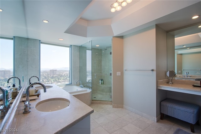 bathroom with tile patterned flooring, vanity, plenty of natural light, and walk in shower