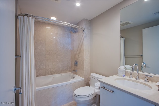 full bathroom featuring vanity, shower / bathtub combination with curtain, and toilet