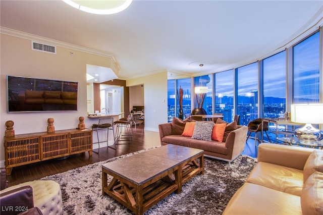 living room with floor to ceiling windows, crown molding, and dark hardwood / wood-style flooring