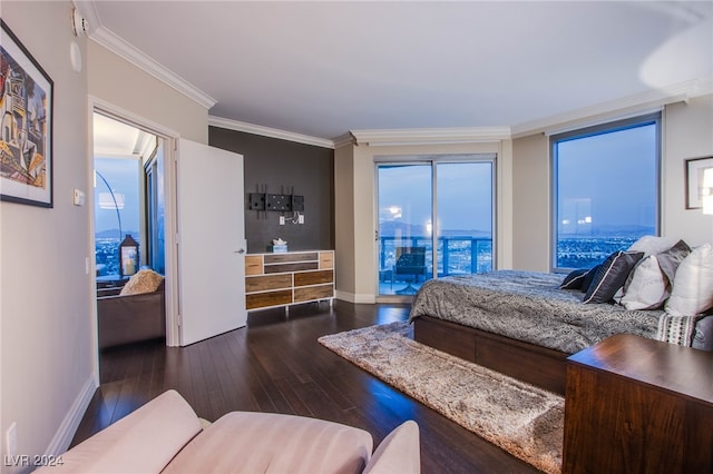 bedroom with dark hardwood / wood-style flooring, crown molding, and access to outside