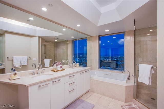 bathroom featuring tile patterned floors, vanity, and independent shower and bath