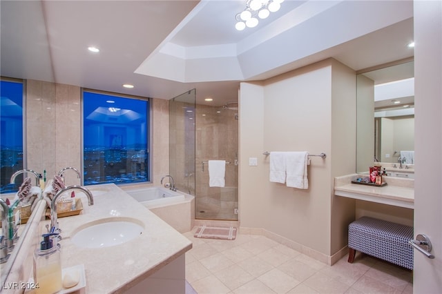 bathroom with tile patterned flooring, vanity, and plus walk in shower