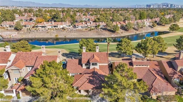 birds eye view of property with a water and mountain view