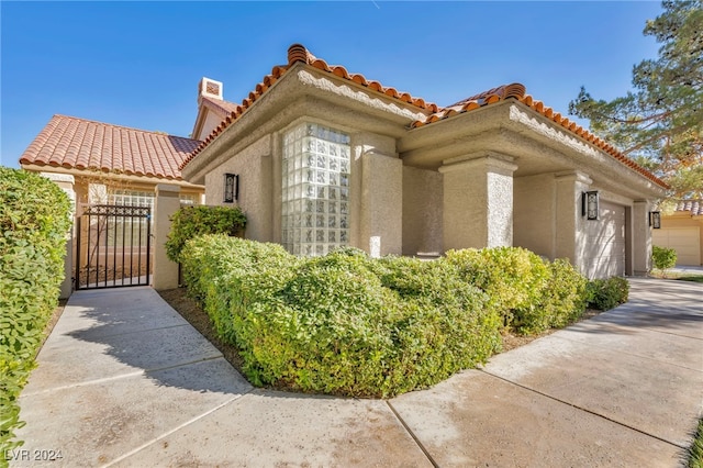 view of side of property featuring a garage