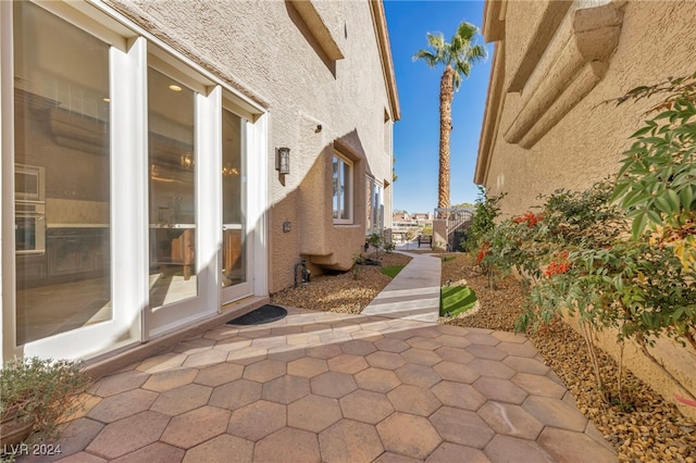 view of side of home with a patio