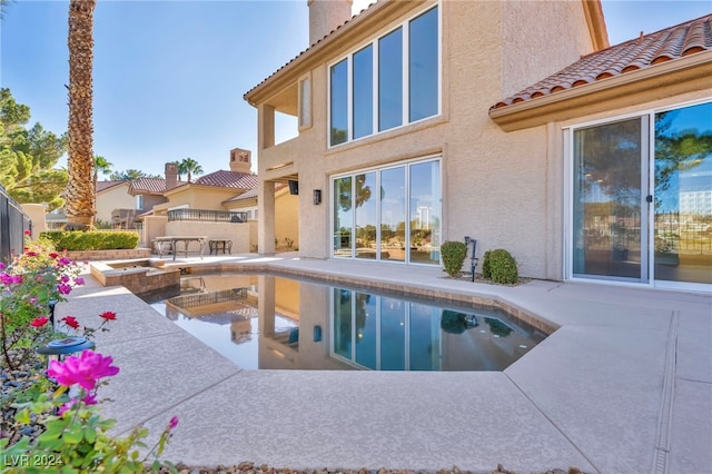 view of swimming pool with a patio