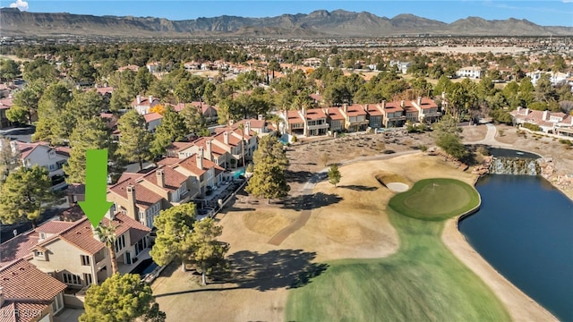 birds eye view of property featuring a water and mountain view