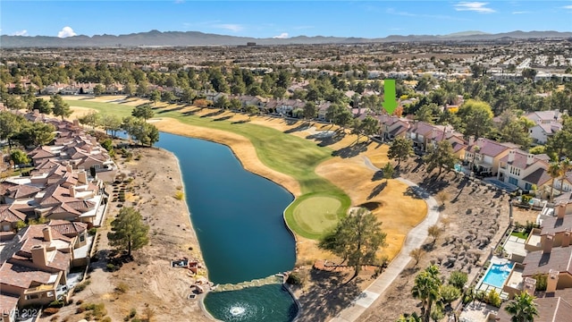 drone / aerial view featuring a water and mountain view