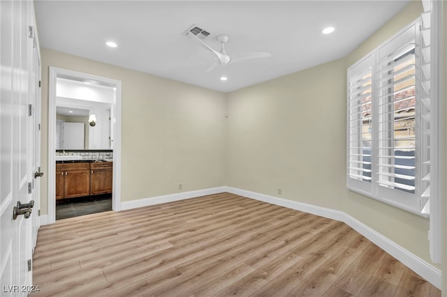 spare room with ceiling fan and light hardwood / wood-style flooring