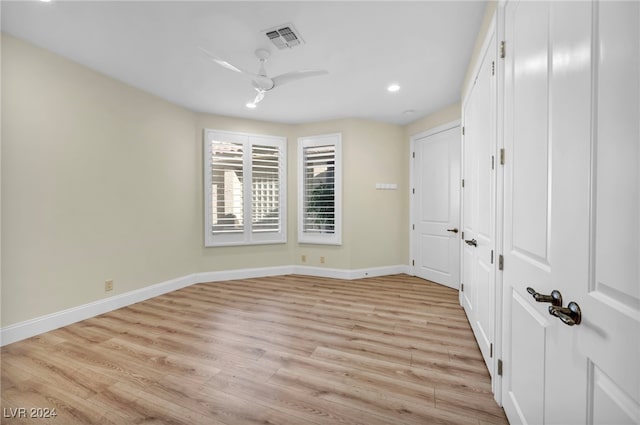 unfurnished bedroom with light hardwood / wood-style flooring and ceiling fan