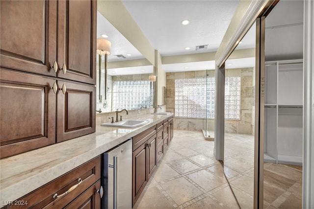 bathroom with vanity and beverage cooler