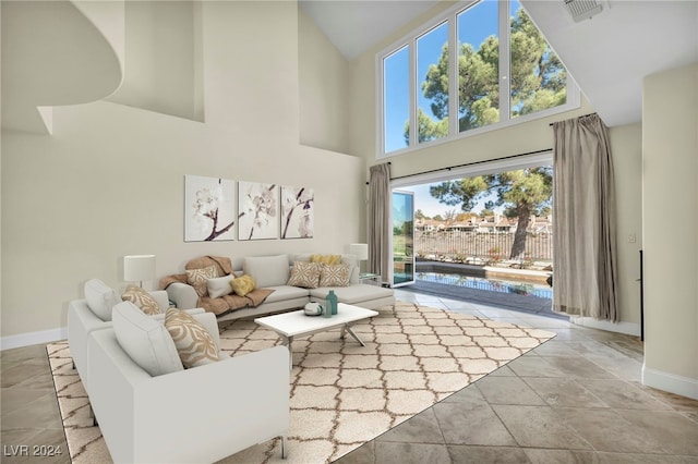 living room featuring high vaulted ceiling