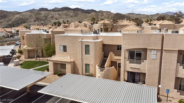 view of building exterior with a mountain view