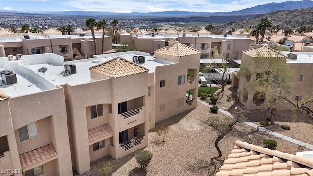 birds eye view of property with a mountain view