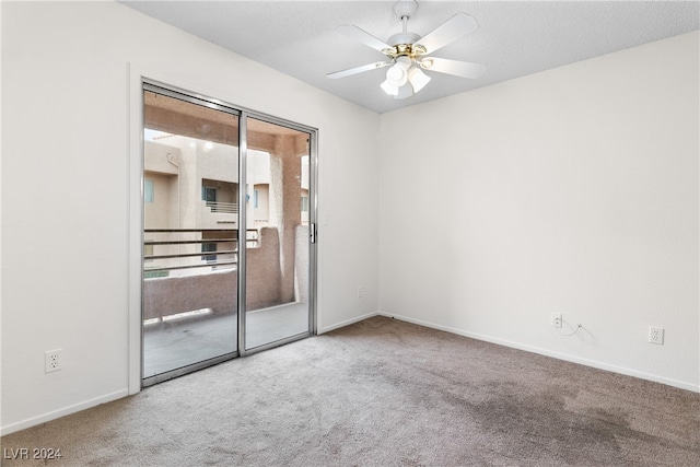 spare room with ceiling fan and carpet floors