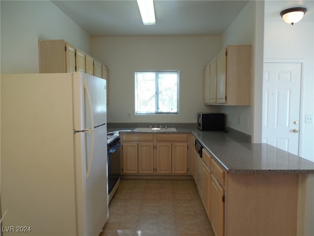 kitchen with kitchen peninsula, gas stove, sink, light brown cabinets, and white refrigerator