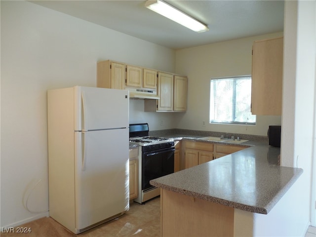 kitchen with sink, kitchen peninsula, white appliances, light brown cabinetry, and light tile patterned floors