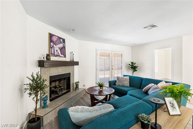 living room with a fireplace and light hardwood / wood-style flooring