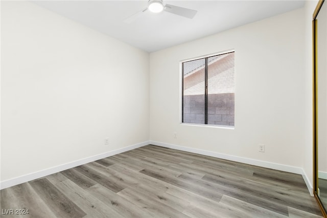 spare room with ceiling fan and light hardwood / wood-style flooring