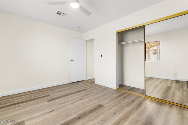 unfurnished bedroom with a closet, ceiling fan, and light hardwood / wood-style flooring