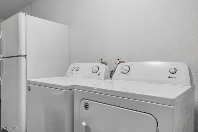 clothes washing area with independent washer and dryer