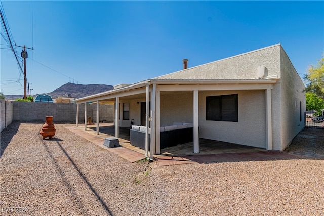 rear view of property with a patio area