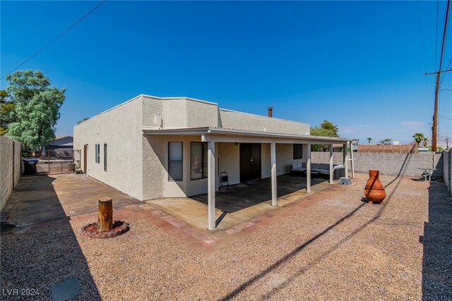 rear view of house with a patio area