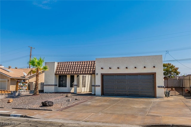 southwest-style home with a garage