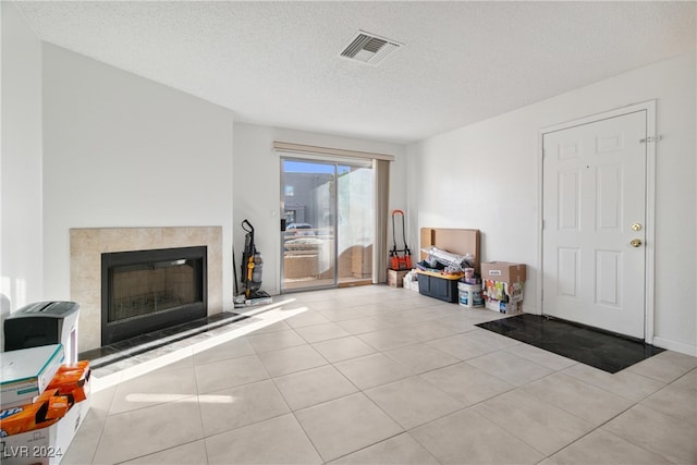 tiled living room with a textured ceiling