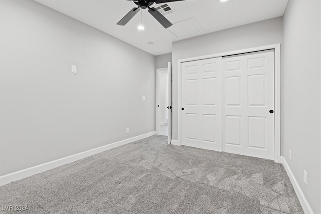 unfurnished bedroom with ceiling fan, a closet, and carpet floors